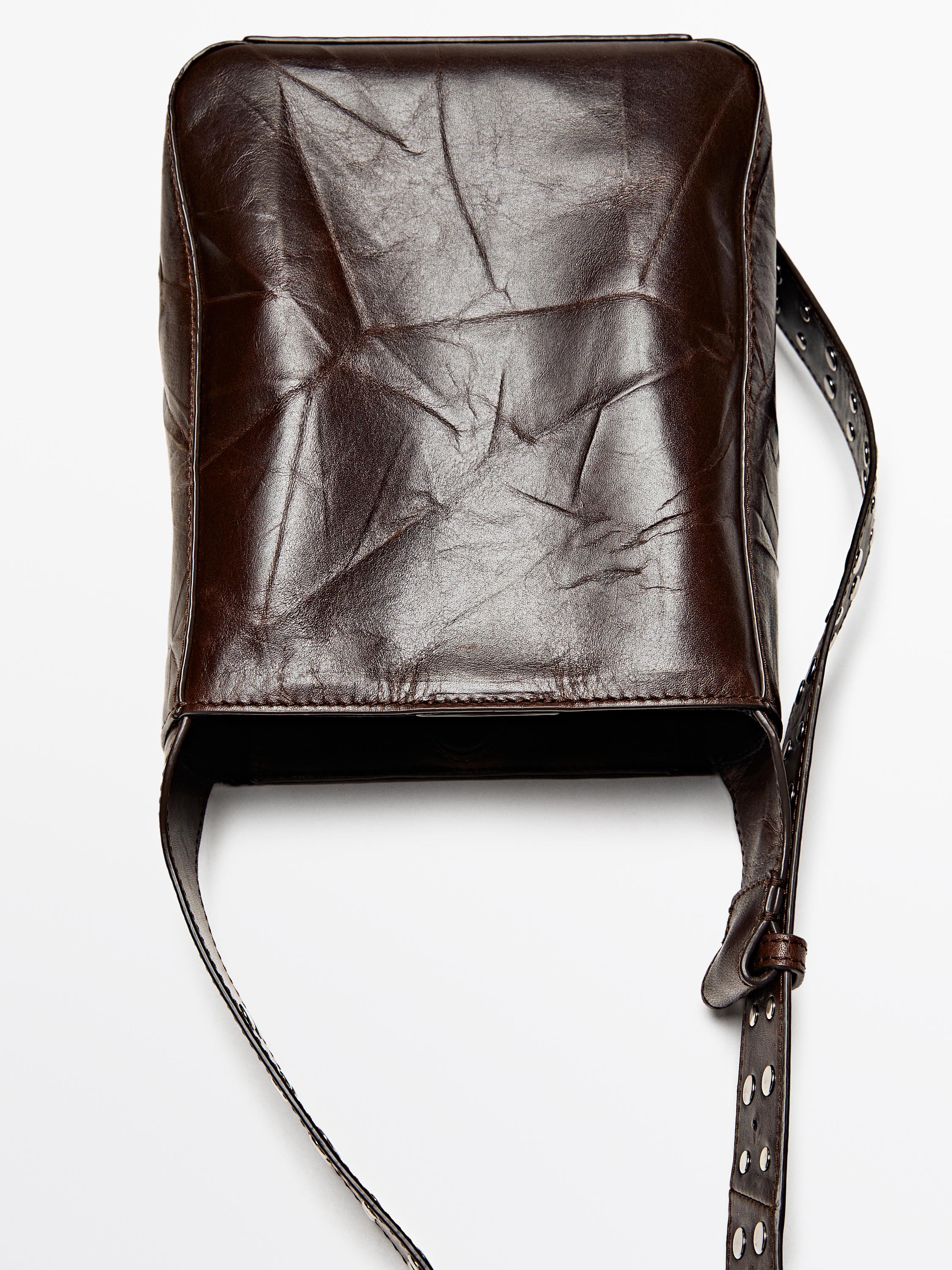 Nappa leather bucket bag with studs